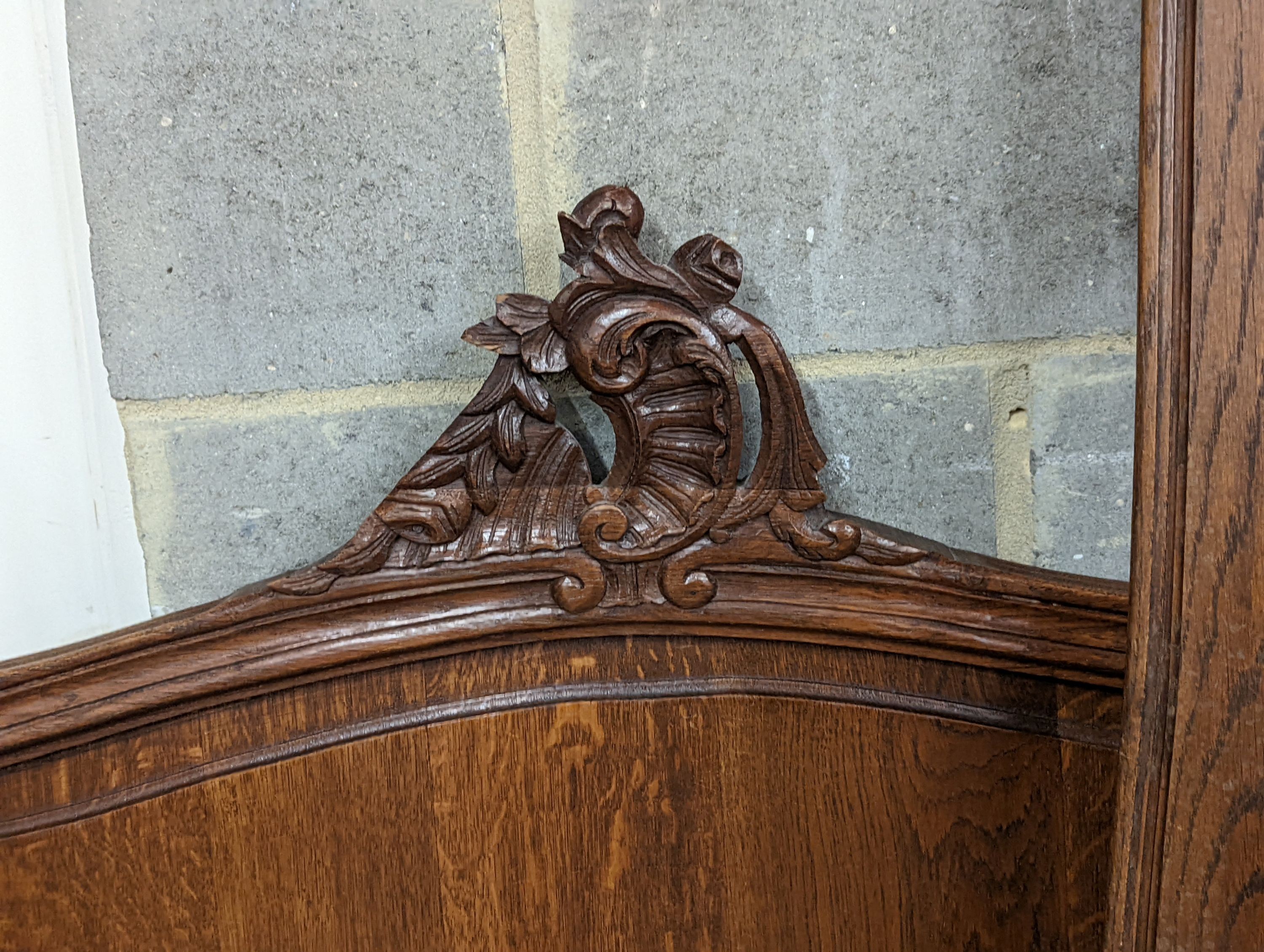 A late 19th century French oak bed frame, no bolts, width 140cm